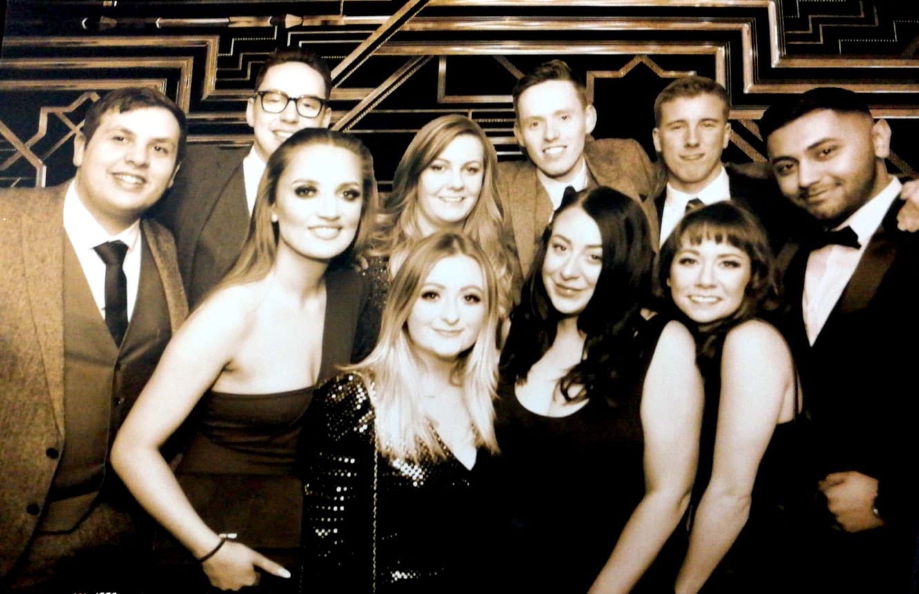 Abby (centre front) on a night out with her branch team