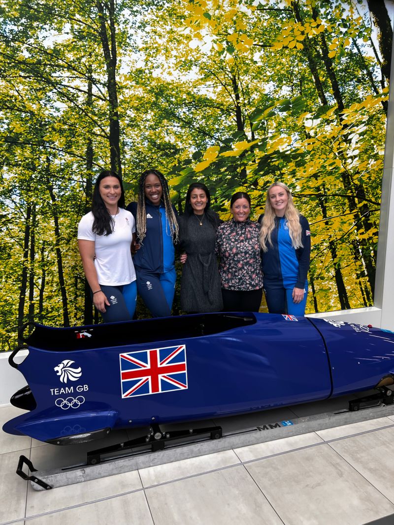 Adele Nicoll, Montell Douglas, Sonya Lawson, Jane Williams and Mica Mcneil pose in front of the women's bobsleigh